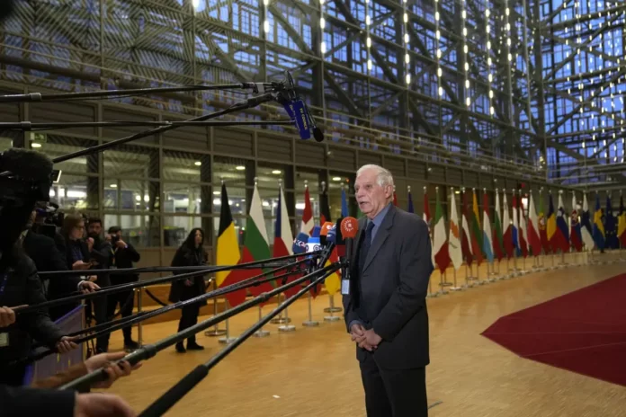 European Union foreign policy chief Josep Borrell speaks with the media as he arrives for a meeting of EU foreign ministers at the European Council building in Brussels on Monday, Jan. 23, 2023. (AP Photo).