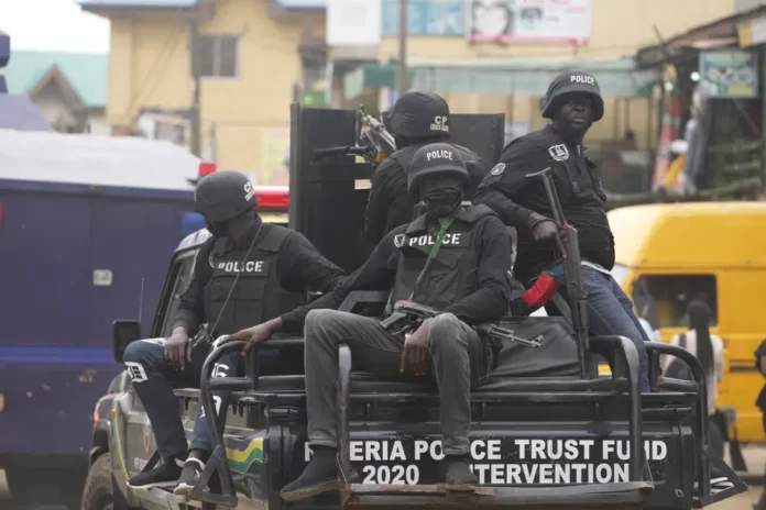 FILE- Police officers patrol during a protest by Nigeria Labour Congress on the street in Lagos, Nigeria, on July 26, 2022. | AP /PHOTO.