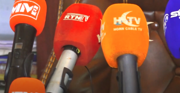 Microphones bearing media outlets' logos are seen in Ethiopia's Somali Regional State. State authorities recently suspended 15 media outlets in the region. (Screenshot: RTN Somali TV/YouTube)