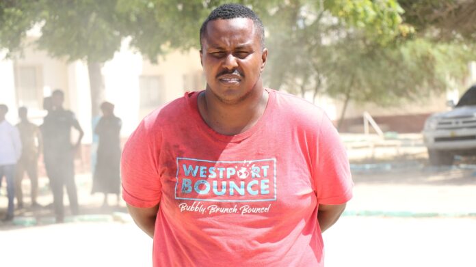 The suspect, identified as 37-year-old Hassan Abdullahi Abdi Shire, was seen being interrogated at a local police station shortly after his arrest.