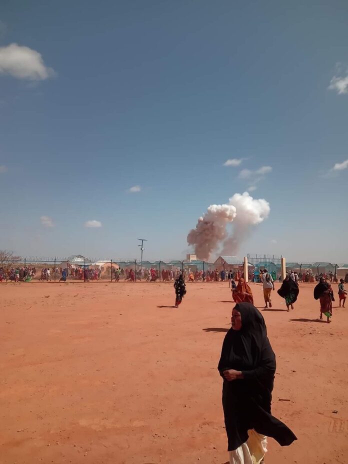 Photos captured individuals residing in a nearby displacement camp seeking safety amidst the chaos.