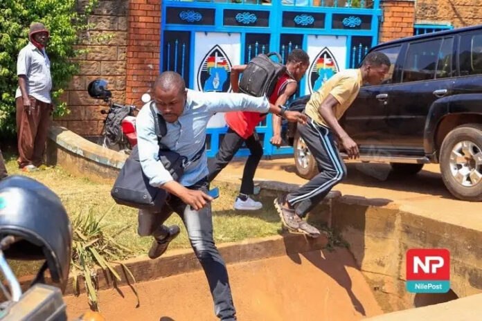 Journalists are seen while being attacked at the headquarters of the Forum for Democratic Change in Kampala, Uganda, on July 20. At least seven journalists were recently attacked at news conferences in Uganda. (Photo: Nile Post)