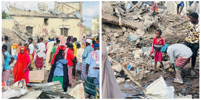 People gather at the aftermath of suicide car bomb in a busy market in Buloburte town in Hiiraan region on Thursday.