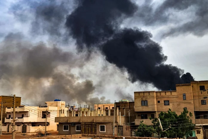 Smoke plumes billow from a fire at a lumber warehouse in Sudan’s capital, Khartoum, amid fighting on June 7, 2023. The fighting, eight weeks in at the time, have pitted Sudan's army chief Abdel Fattah al-Burhan against his former deputy Mohamed Hamdan Daglo who commands the Rapid Support Forces (RSF). © 2023 AFP via Getty Images