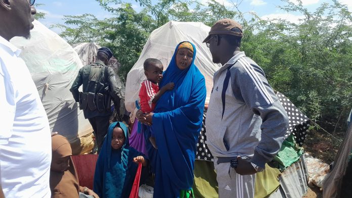 FILE PHOTO: Officials visit a displacement camp in Afgooye town, Lower Shabelle region.