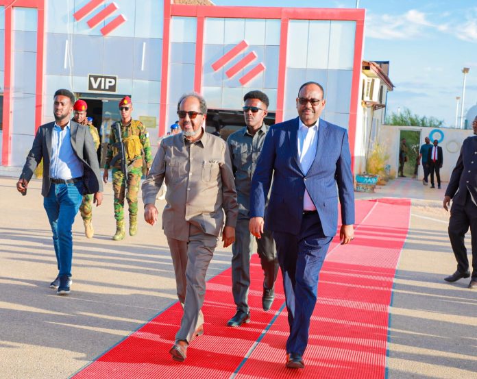 Puntland president Said Abdullahi Deni [right] farewells Somalia president Hassan Sheikh Mohamud [left] in Garowe on Jan., 26.