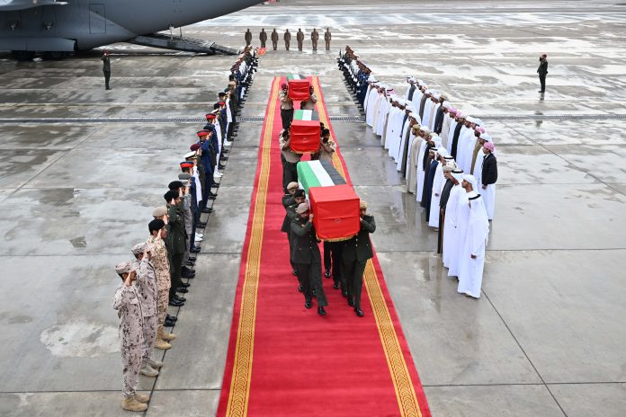 In this photo released by UAE news agency on Sunday, the bodies of four UAE military trainers arrived Al Bateen Executive Airport in Abu Dhabi this morning on board a military aircraft belonging to the Armed Forces.