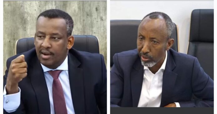 MP Abdullahi Farah Mire (left) grills Minister of Education Federal Government of Somalia, Farah Abdulkadir.