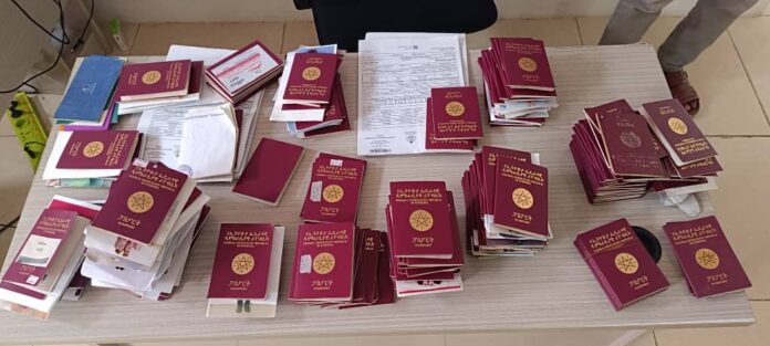 The operation led to the arrest of 49 travel agency owners, along with the seizure of a cache of documents, including Ethiopian passports, birth certificates, and airline tickets.