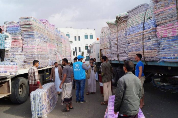 UNHCR staff seen during distribution of lifesaving material to displaced people Yemen. | UN PHOTO July 2015.